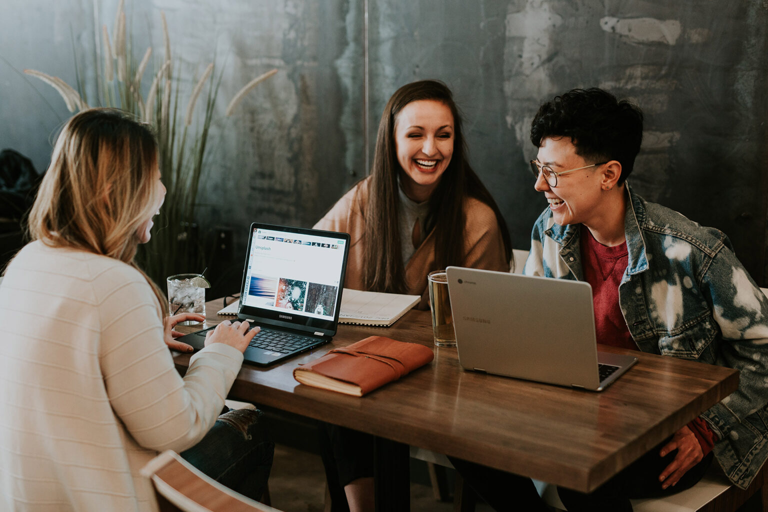 Group of people working a table - employer branding